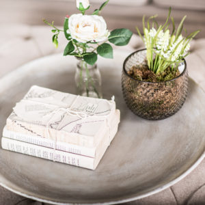 Flowers and books on side table