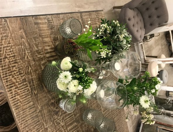 Foliage and glassware on table