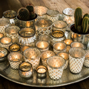 Vintage votives with lit candles