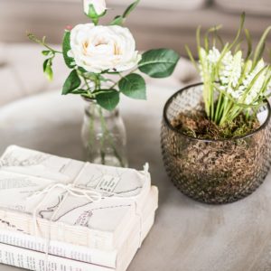 side table with flowers and books