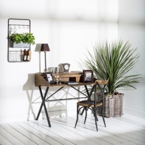 Wooden and metal desk with wall mounted storage unit