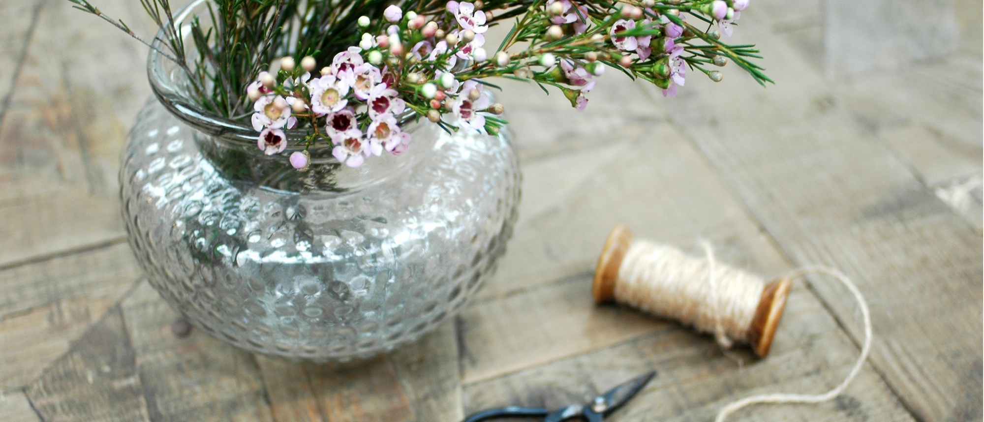 Vase of flowers and cotton thread