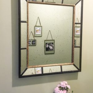 Vintage style mirror above bathroom sink