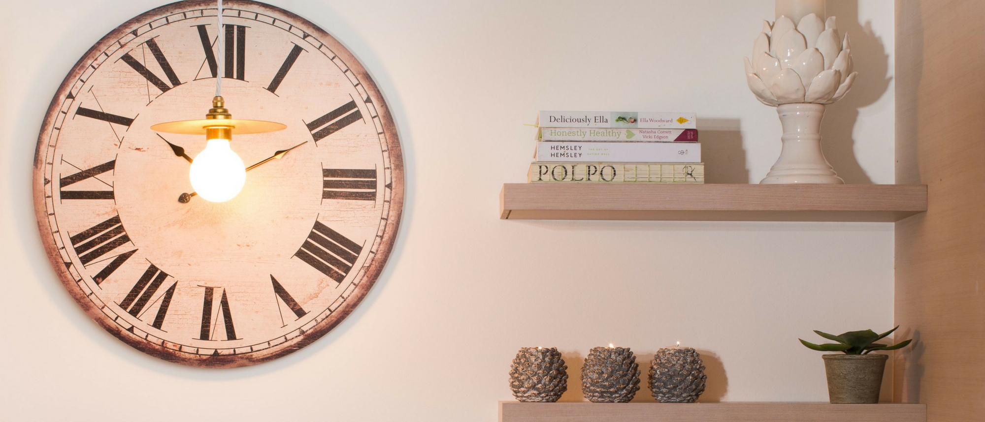 Open shelving with large wall clock