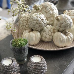 Faux white artichokes and pumpkins on tray