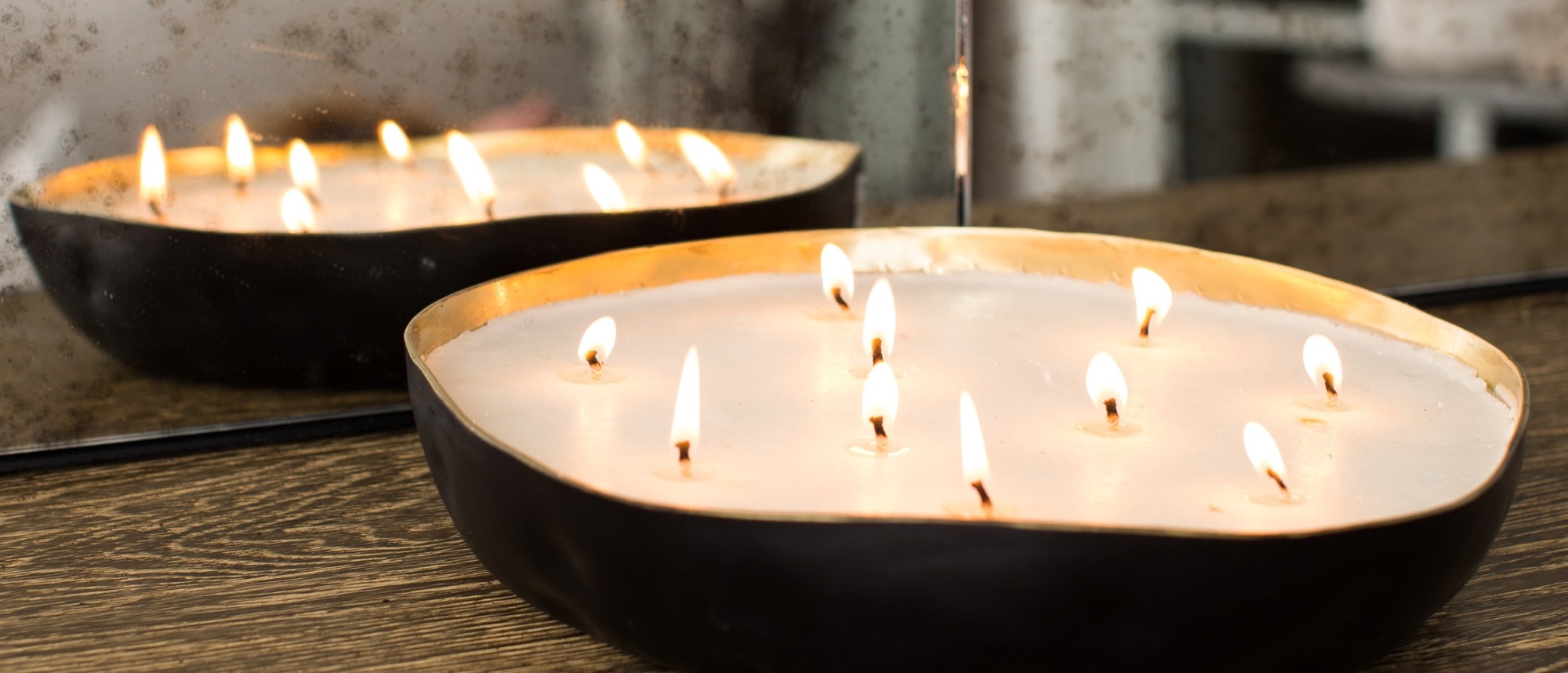 Large Multiwick candle against antiqued mirror