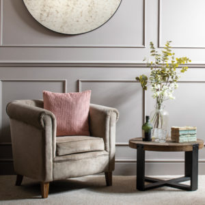 Small chair with coffee table and pink cushion