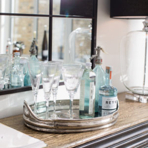 Wine glasses on a tray with gin