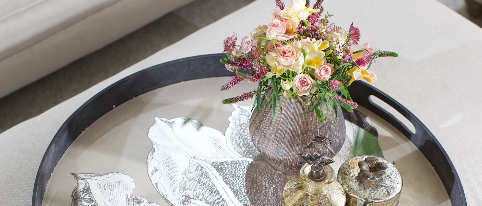 Antique tray with small posy of flowers