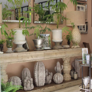 Green plants, stone vases on table at Chelsea Flower Show