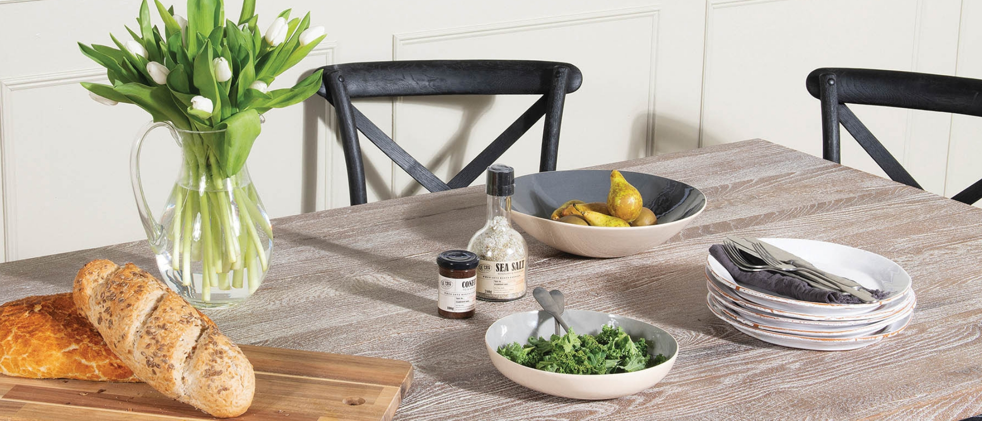 Dining table with salads and bread