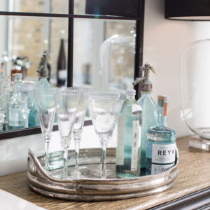 Wine glasses and gin on a silver tray